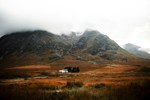 Mountain in Scotland with small house