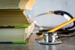 text books and stethoscope